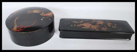 Two 20th Century Japanese boxes to include a paper mache lacquered box of round from having hand