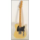A six string electric guitar Telecaster style by Forida having maple neck and chrome tuning pegs
