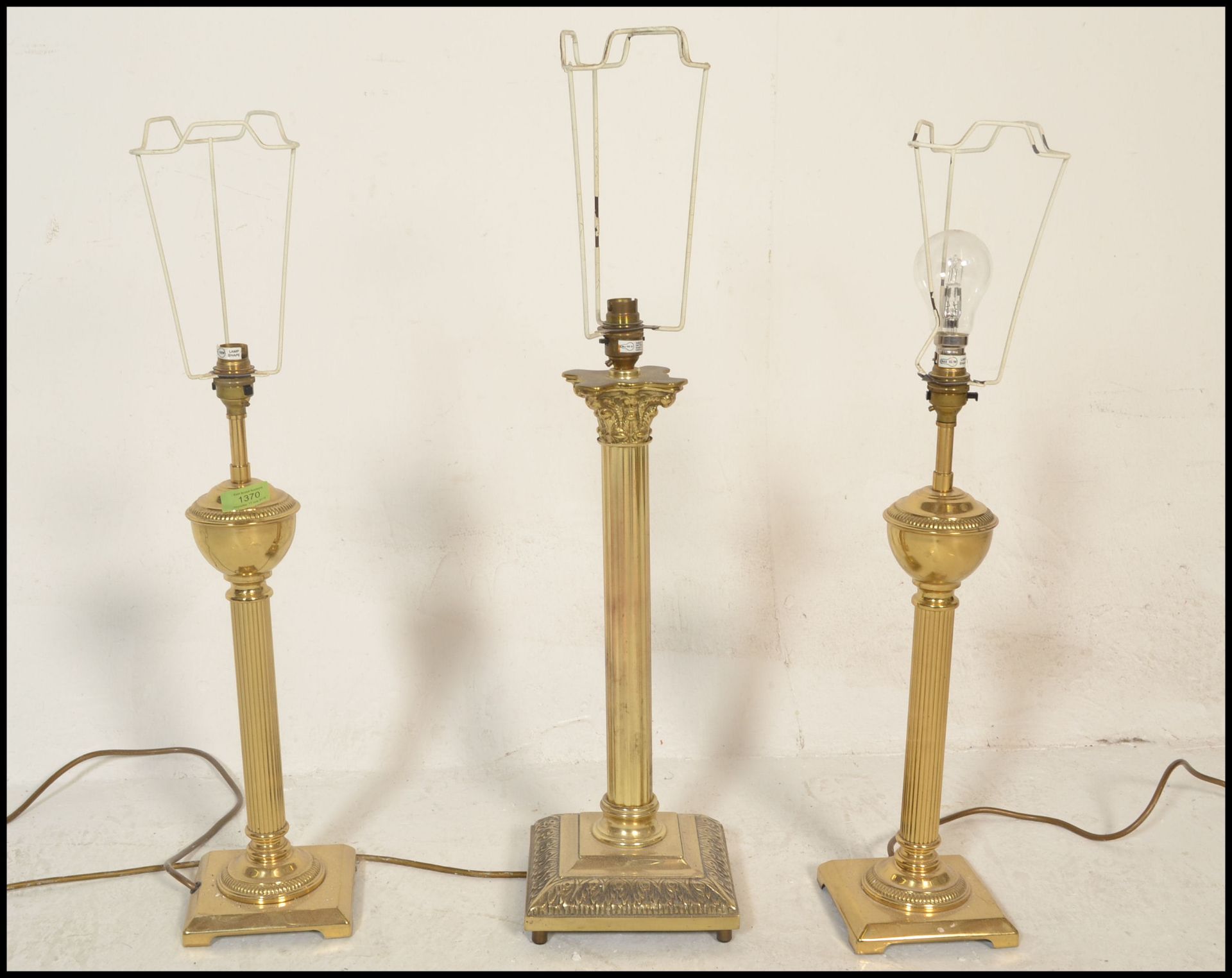 A pair of reeded column table lamps being of brass construction with neo classical doric columns