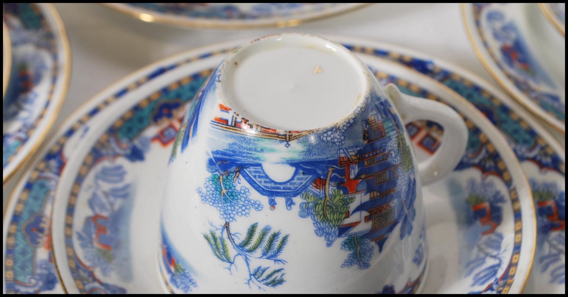 A 20th Century Staffordshire blue and white tea service in the Willow pattern, having red and - Image 8 of 8
