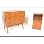 A retro 20th Century teak wood chest of three drawers, flared top raised on tapering supports,