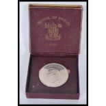 A silver Festival of Britain 1951 crown coin complete in the presentation box. Weight 28.1g.