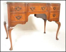 A good Queen Anne revival walnut serpentine fronted writing table desk. Raised on cabriole legs with