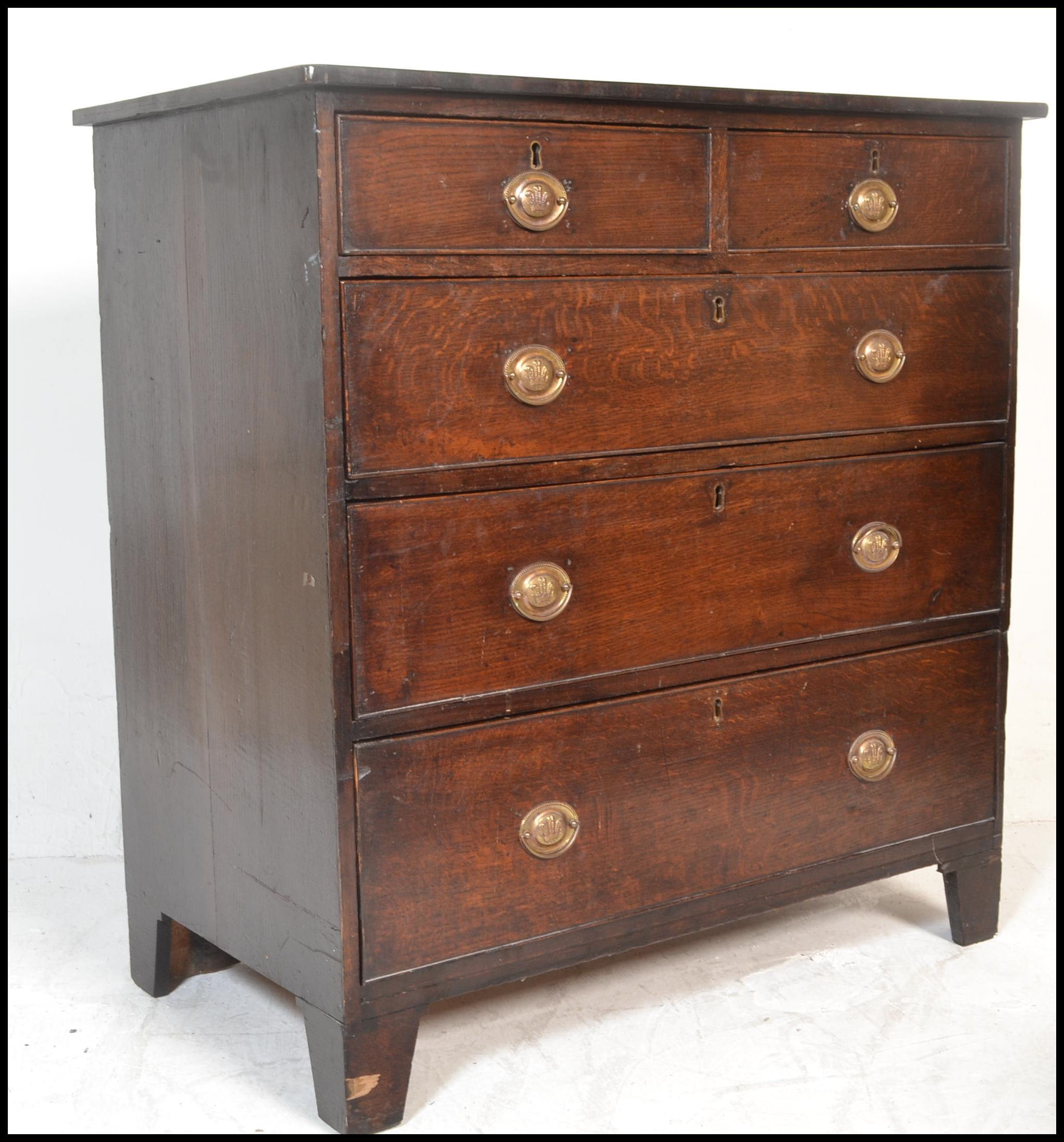 A good 18th / early 19th century oak chest of drawers . Raised on bracket legs the upright chest