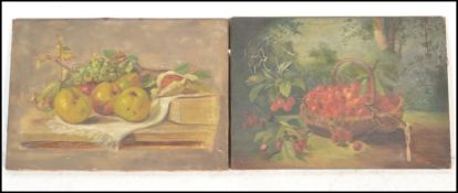A pair of early 20th Century still life oil on canvas paintings, one depicting a basket of