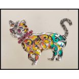 A contemporary silver plique a jour ladies brooch in the form of a cat with curly tail. Measures