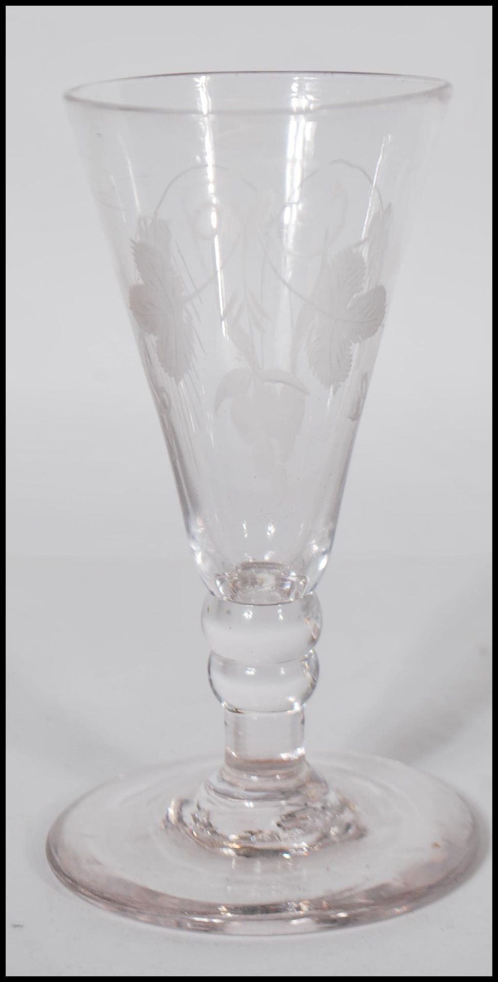 A 18th / 19th Century Georgian cut glass toddy lifter together with a Georgian etched wine glass - Image 5 of 7