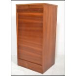 A mid century teak wood tambour fronted office Industrial filing cabinet. Of pedestal form having