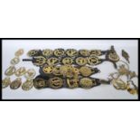 A collection of 20th Century horse brasses to include souvenir badges for Stratford upon Avon,