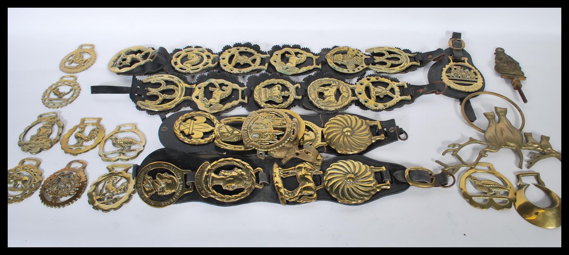 A collection of 20th Century horse brasses to include souvenir badges for Stratford upon Avon,