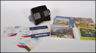A vintage 20th Century bakelite Viewmaster slide viewer together with a selection of slide cards