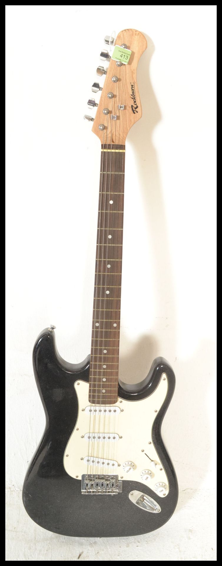 A vintage Rockburn electric six string guitar. The black body having white scratch guard with chrome - Bild 5 aus 5