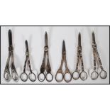 A collection of silver plated grape scissors datin