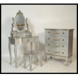 A contemporary French silvered commode chest of drawers with matching dressing table and stool. Each