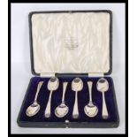 A cased set of six Cooper Brothers & Sons silver hallmarked tea spoons within a velvet lined