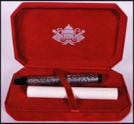 A Vatican Museums collection souvenir fountain pen having decorated with silver plated metal knot