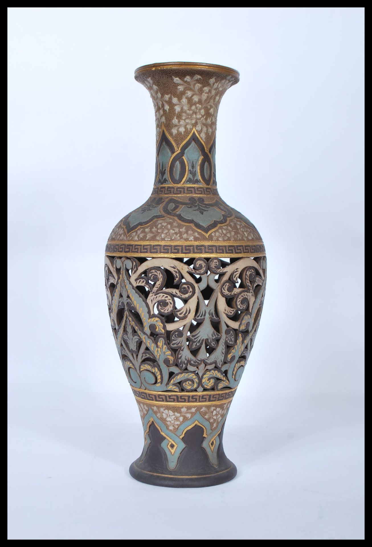 A 19th century Doulton Lambeth stoneware fret pierced vase of baluster form. Lattice pierced