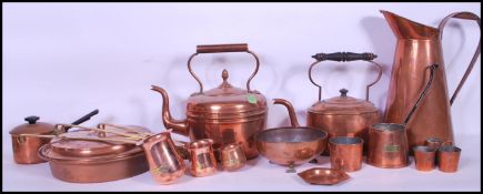 A collection of brass wares dating from the 20th Century to include drinks measures, kettle, water