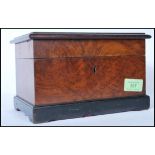 An early 20th Century wooden tunbridge jewellery box having geometric wooden inlay to the lid and