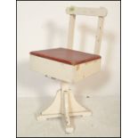 A mid 20th Century scratch built childs swivel chair, the two tone chair painted chair having