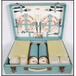 A vintage mid 20th Century Sirram picnic set hamper for four. Carry handle to the front of the