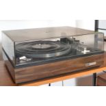 A vintage teak cased Elac Miracord turntable record deck, teak body with smoked perspex lid.