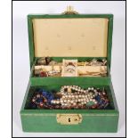 A collection of vintage 20th Century costume jewellery to include brooches, dress rings, cuff links,