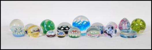 A good collection of retro vintage 20th Century studio art glass paperweights including Caithness,