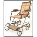 An early 20th Century invalid / promenade chair by Alwin, folding frame cane panelled seat and
