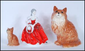 A collection of 20th century ceramic figurines to include  two Beswick cat figurines together with a