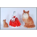 A collection of 20th century ceramic figurines to include  two Beswick cat figurines together with a