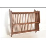 A 20th Century antique style country pine two tier slatted wall hanging plate rack. The plate rack