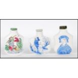 A group of three 20th Century Chinese snuff bottles to include a hand painted bottle depicting a man