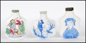 A group of three 20th Century Chinese snuff bottles to include a hand painted bottle depicting a man