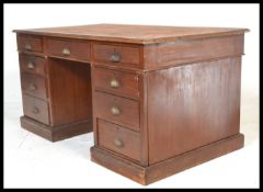 A Victorian 19th Century mahogany twin pedestal Partners desk, later tooled green leather inset to