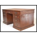 A Victorian 19th Century mahogany twin pedestal Partners desk, later tooled green leather inset to