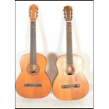 Two 20th Century Spanish classical acoustic guitars by Tantra having hollow bodies with ebonised