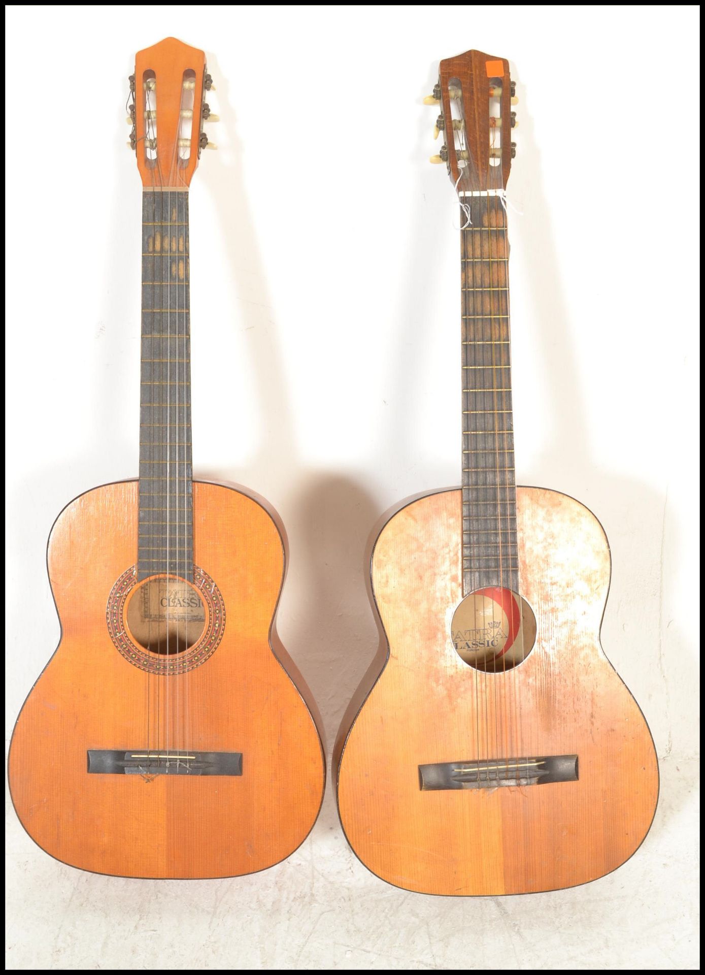 Two 20th Century Spanish classical acoustic guitars by Tantra having hollow bodies with ebonised