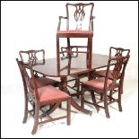 A large Regency revival  mahogany pedestal dining table together with a matching set of 6