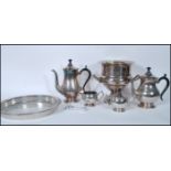 A mid 20th Century silver plated tea service consisting of teapot, water pot, creamer, sugar bowl