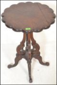 A late 19th Century high Victorian mahogany wine / occasional table, the scalloped top having