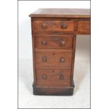 A 19th Century high Victorian twin pedestal mahogany desk, the twin pedestal having a