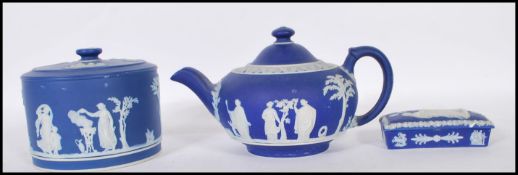 A collection of three cobalt 19th Century Victorian Wedgwood jasperware pieces to include teapot,