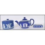 A collection of three cobalt 19th Century Victorian Wedgwood jasperware pieces to include teapot,