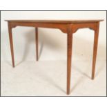 A good mid century oak dining table, possible Air Ministry origin. Raised on turned legs with a