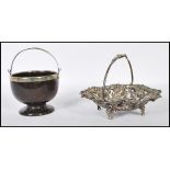 A 20th century white metal and silver bon bon dish with grape and vine embellished decoration having