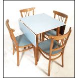 A retro mid 20th Century 1950's pale blue Formica topped drop leaf kitchen dining table raised on