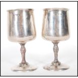 A pair of silver hallmarked Cooper Brothers & Sons goblets having round bases with bark effect