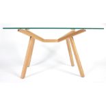 A CONTEMPORARY OAK AND GLASS DINING TABLE BY SEAN