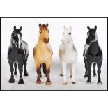 A collection of four Beswick ceramic figurines modelled as horses / ponies to include a Grey